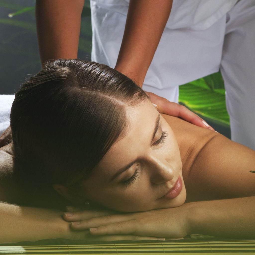 Health and wellness. Young woman lying on massage table.